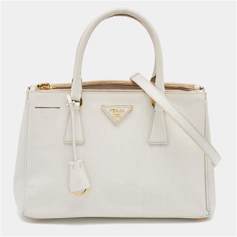 prada bucket bag saffiano leather gold tone white|prada saffiano tote price.